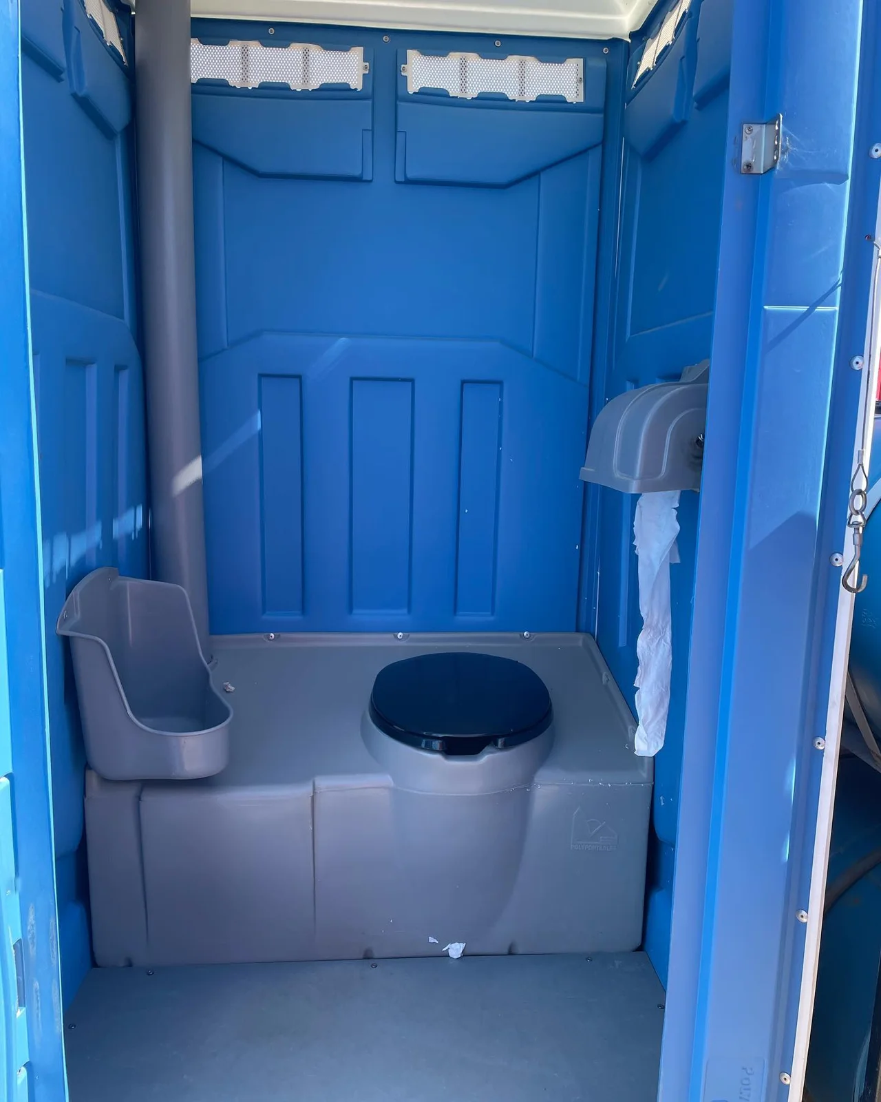 Interior of a blue portable toilet