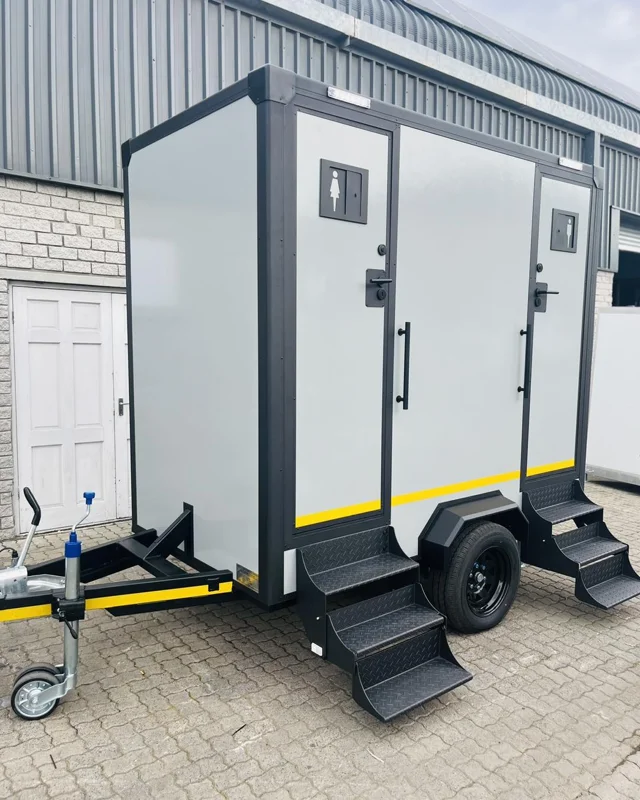 A restroom trailer with exterior entry steps