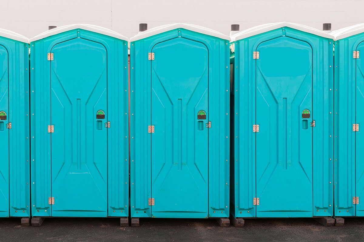 Industrial portable restroom units at a plant in Arlington, Texas